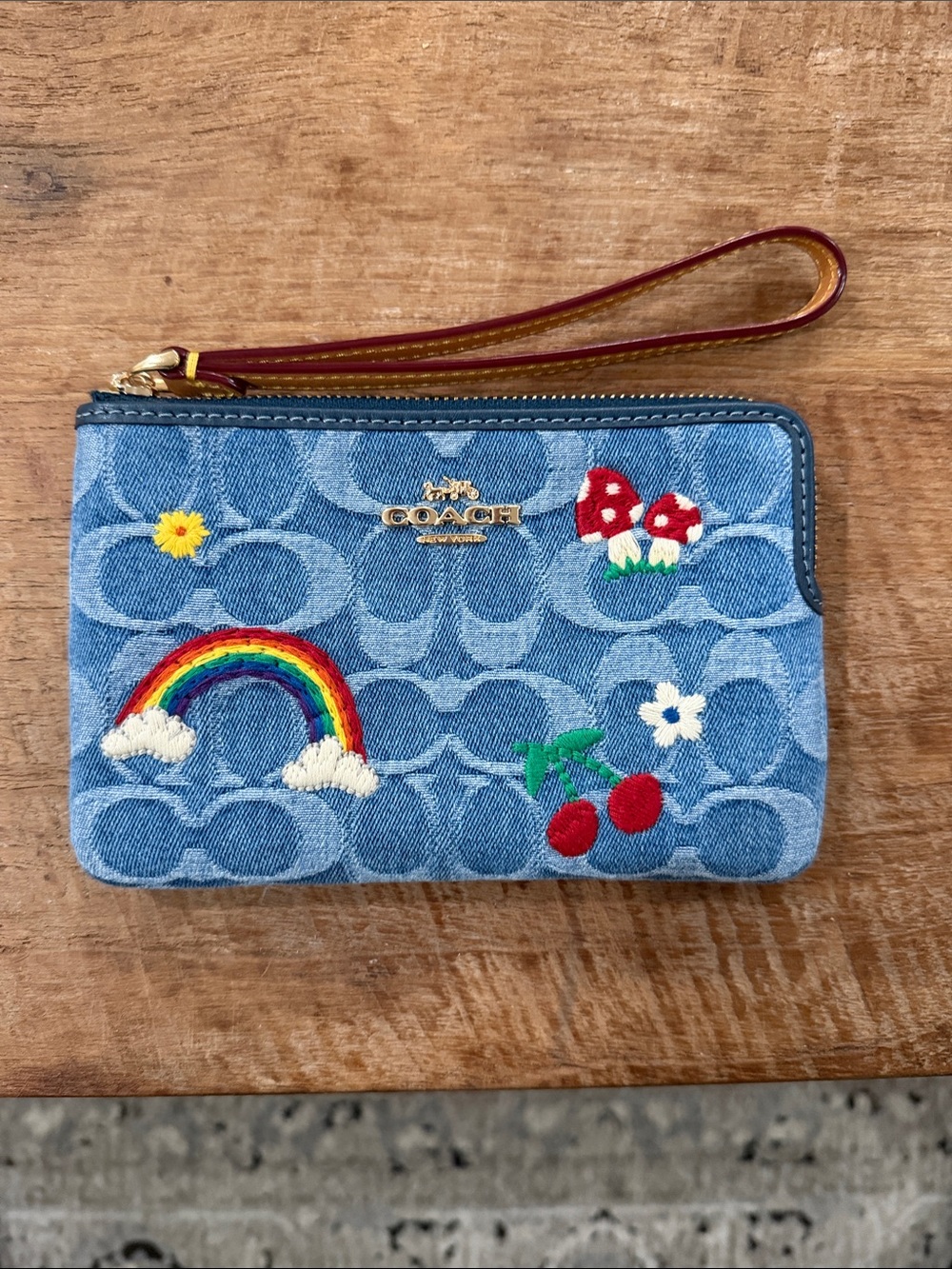 Coach Denim Wristlet with Rainbow, Cherry & Mushroom Embroidery - Blue